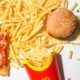 Burger and Fries on White Table