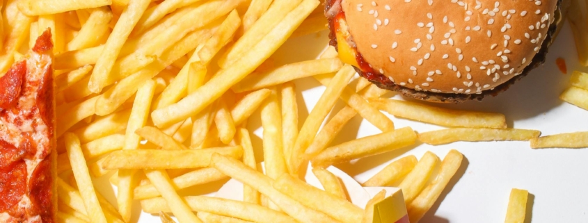 Burger and Fries on White Table