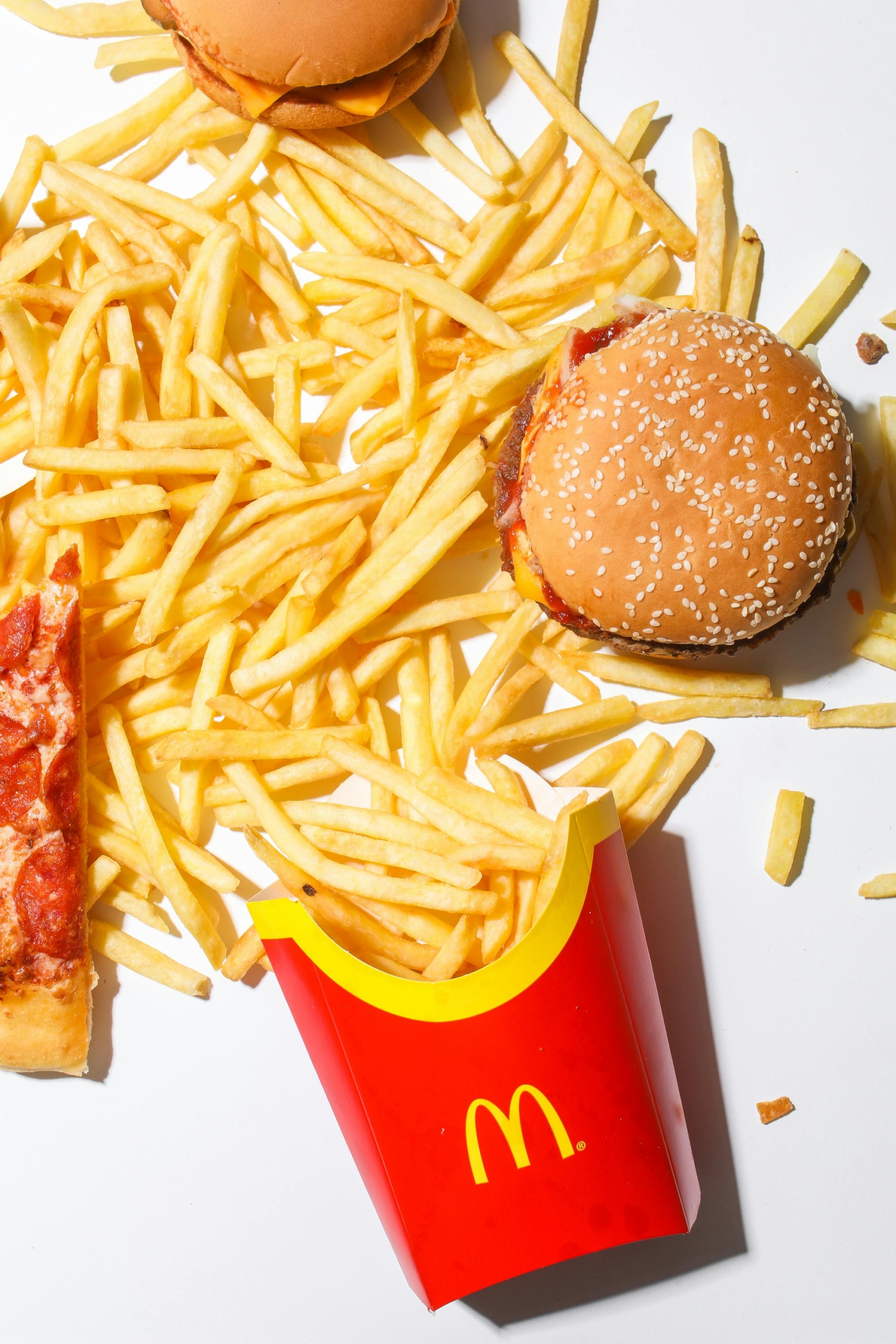 Burger and Fries on White Table