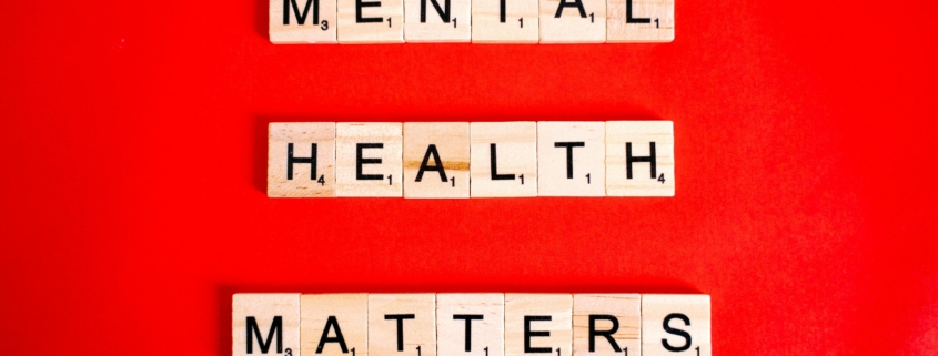 Mental Health Matters Spelled on Letter Tiles on Red Background